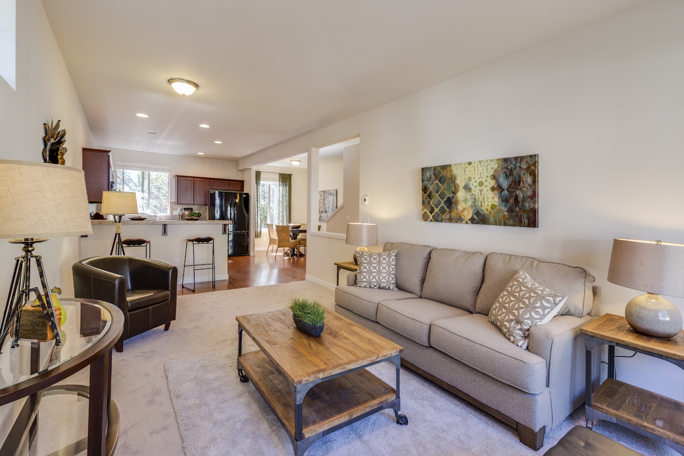 A bright living area with a fireplace and large windows